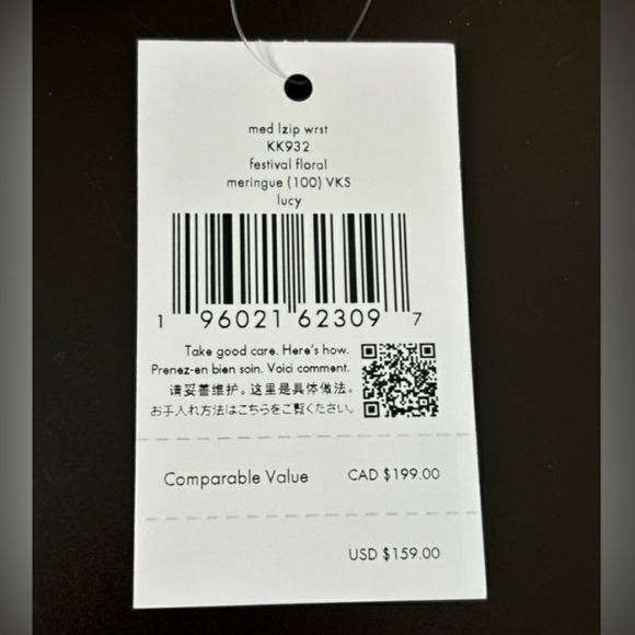 Kate Spade Cream Wristlet with Floral Cutouts - Picture 2 of 8